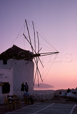 Dusk over windmill and taverna    Ios Cyclades Islands Greece