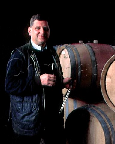 Karl Heinz Johner with glass of his Blauer   Spatburgunder Pinot Noir taken from barrique   Bischoffingen Baden Germany Kaiserstuhl