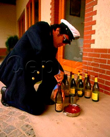 Bottles being sealed with wax by customs official   before going for analysis prior to export to Canada    Cantina Silvio Jermann   Villanova di Farra Friuli Italy   Collio