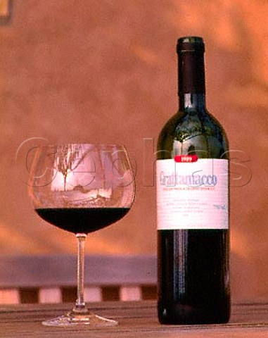 Bottle and glass of Grattamacco Rosso  Castagneto Carducci Tuscany Italy  Bolgheri