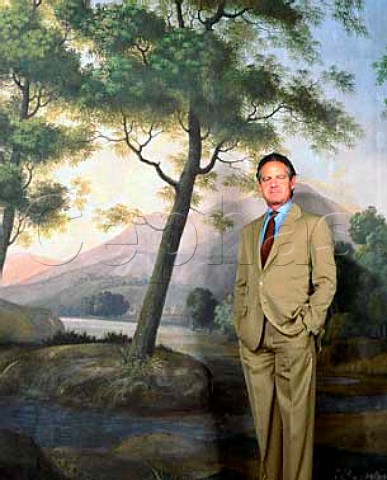 Marchese Piero Antinori in front of a mural in his   company headquarters the Palazzo Antinori in the   centre of Florence Tuscany Italy