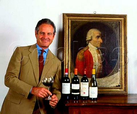 Marchese Piero Antinori with a selection of his best   wines in the headquarters of his company the Palazzo   Antinori The painting dated 1786  is of Donatus Maria Antinori  Florence Tuscany Italy