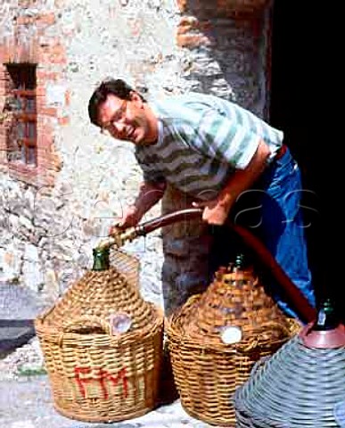 Filling demijohns with wine in the hamlet of Ama   near Lecchi Tuscany Italy     Chianti Classico