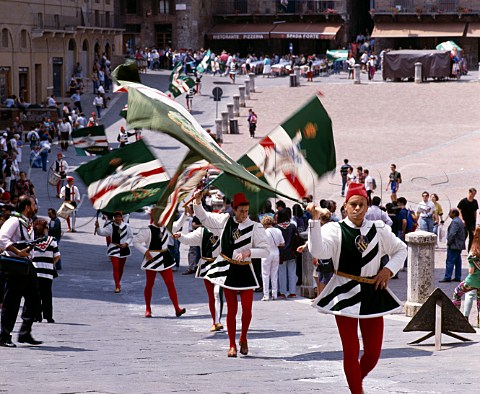 One of the citys contrade in a Sunday procession   around the Piazza del Campo Siena Tuscany Italy