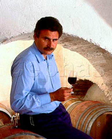 Consultant winemaker Maurizio Castelli with a   sample of Balifico a vdt of Sangioveto Mammolo and   Cabernet from barrique in the cellars of Castello di   Volpaia Tuscany Italy