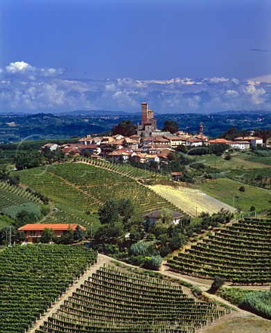 Serralunga dAlba and its medieval castle with the Alps in far distance Piemonte Italy Barolo