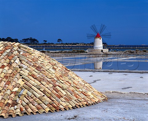Salt pans near Marsala  the piles of salt are   covered over to allow them to dry      Trapani province Sicily