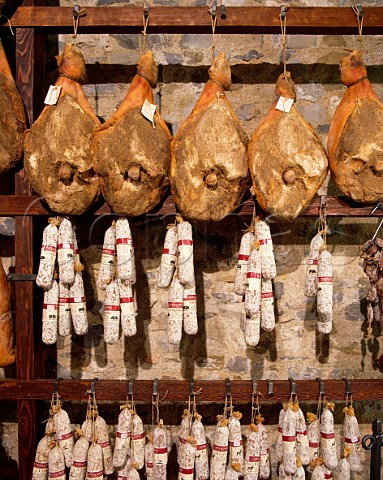 Hams and salami boar and goose on sale in Macelleria Stiaccini Castellina in Chianti Tuscany Italy