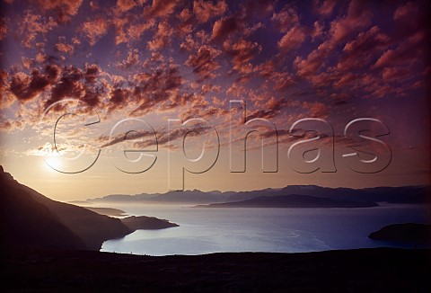 The midnight sun at 1am in early July over  Reisafjord near Srkjosen  Norway