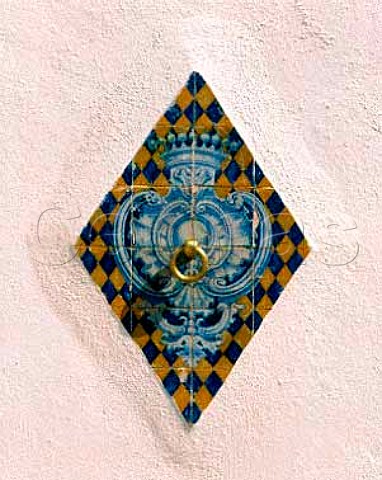 Horse hitching ring in the courtyard of the winery   of the Conde de Santar estate near Viseu in the Dao   region The crown is for Conde count and blue and   gold are the colours of Santar