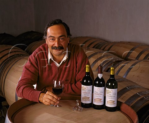 Luis Pato with a selection of his wines in the   barrel room of his Quinta da Cha winery The barrels   are made in Portugal out of French oak    Bairrada