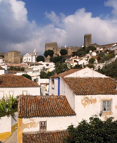The walled town of Obidos Estremadura Known as The Wedding City it was the traditional bridal gift of  the kings of Portugal to their queens a custom begun in 1282 by Dom Dinis and Dona Isabella