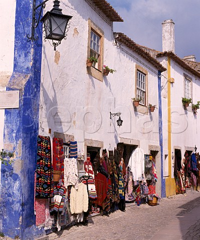 Shops selling local crafts in Obidos Estremadura Portugal   Known as The Wedding City it was the traditional  bridal gift of the kings of Portugal to their queens  a custom begun in 1282 by Dom Dinis and Dona Isabella