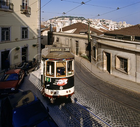 Tram climbing one of many steep streets in Lisbon   Portugal
