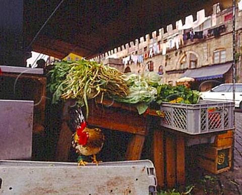 Vegetables and chickens for sale along the Cais da   Ribeira the waterfront area of Porto alongside the   Douro River Portugal