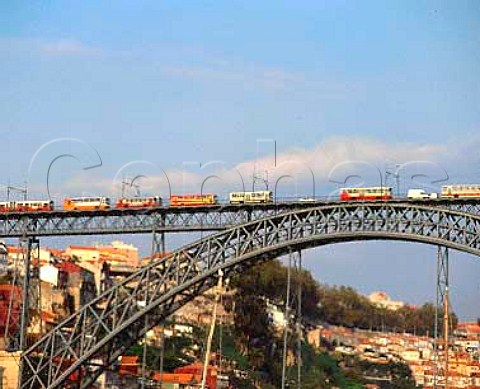 Buses and a tram crossing Eiffels Ponte de Dom Luis   I over the Douro River between Vila Nova de Gaia and   Porto Portugal