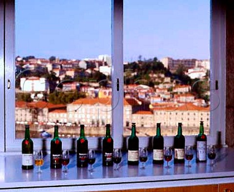 Tasting bottles of Port in Taylors laboratory overlooking Oporto Portugal