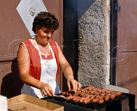 Woman cooking at kebab stall in Rupea north west of Brasov Romania