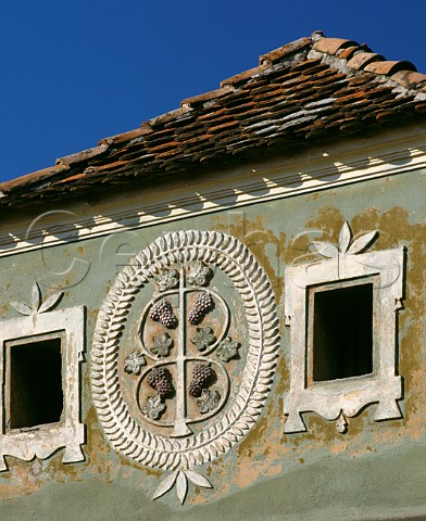 Plaster relief depicting grapes on a house at Hogilag in the Tirnave area of Transylvania This area between the Tirnava Mare and Tirnava Mica rivers is one of Romanias main wine regions