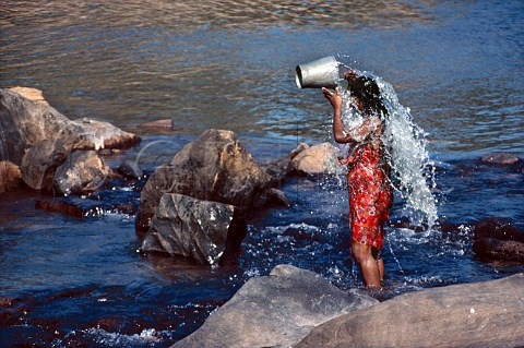 Woman washing in the Mahaweli River near Kandy Sri Lanka
