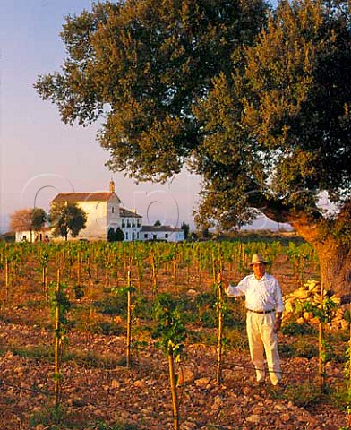 Carlos Falco  Marques de Grinon in vineyard of   young Syrah vines on his estate of Valdepusa at   Malpica de Tajo west of Toledo Spain Altitude is   480m His house Casa de Vacas is beyond
