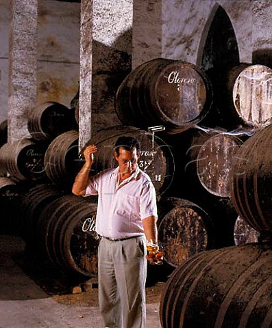 Angel Barcia Capataz foreman of the bodega using   a venencia to sample Oloroso from barrel in Osbornes La Palma bodega Puerto de Santa Maria   Andaluca Spain    Sherry