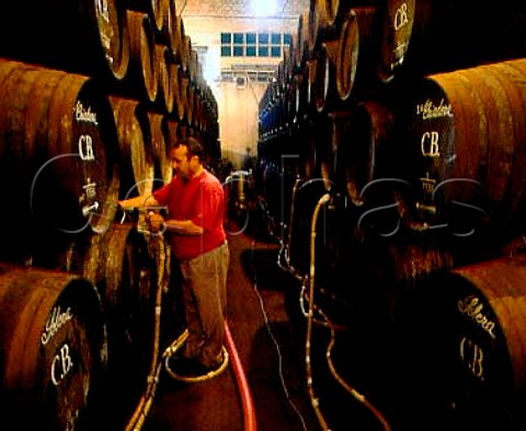 Moving wine from one criadera to another in the   bodegas of Alvear Montilla Andalucia Spain DO   MontillaMoriles