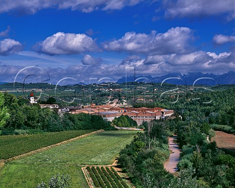 The bodegas of Codorniu by the Anoia river with the Sierra de Montserrat in distance Sant Sadurni dAnoia Catalonia Spain Penedes