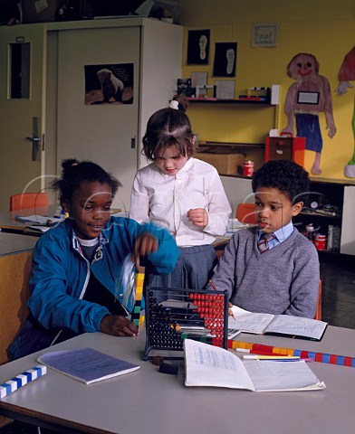 Three primary school children in classroom