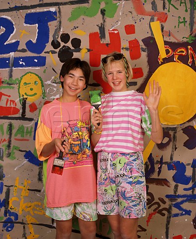 Teenage boy and girl 14 with painted wall