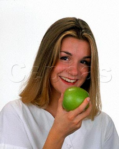 Young woman with apple