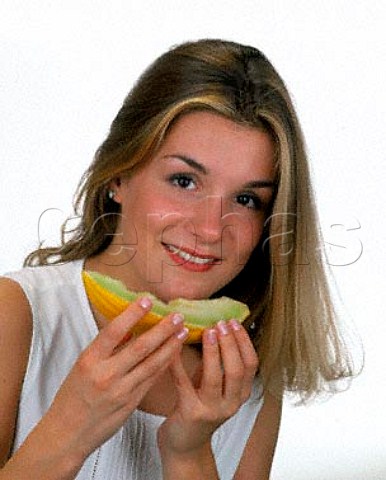 18year old girl eating a slice of melon