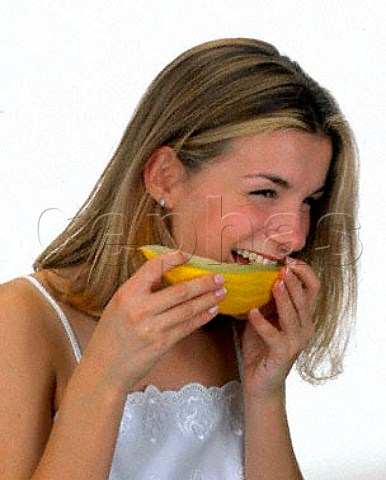 18year old girl eating a slice of melon