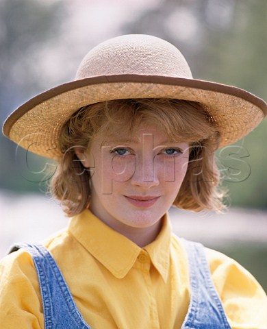 Young woman 16 in straw hat