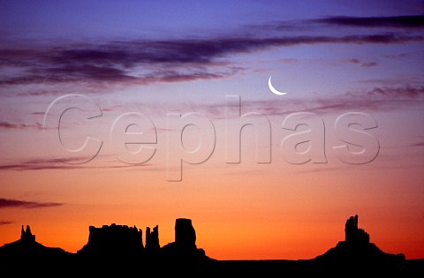 Dawn breaking over the North Buttes in   Monument Valley Arizona  Utah USA