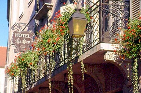 Window boxes and ornamental light   outside Hotel Le Cep in Beaune France