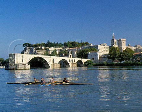 Saint Benezet Bridge made famous by the song Sur   le Pont dAvignon and the 14th century Popes   Palace at Avignon reflected in the Rhone River   Provence  France