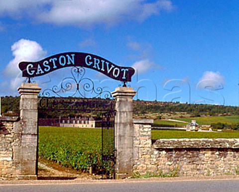 Small entrance to Clos de Vougeot domaine Gaston   Grivot Grand Cru vineyard from the N74 Chteau Clos   de Vougeot can be seen through the gates Cte de   Nuits