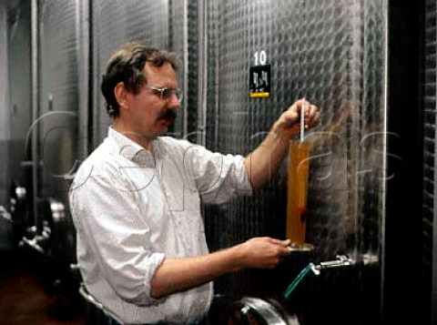 Reiner Lingenfelder checking the specific gravity of   his wine Grosskarlbach Pfalz
