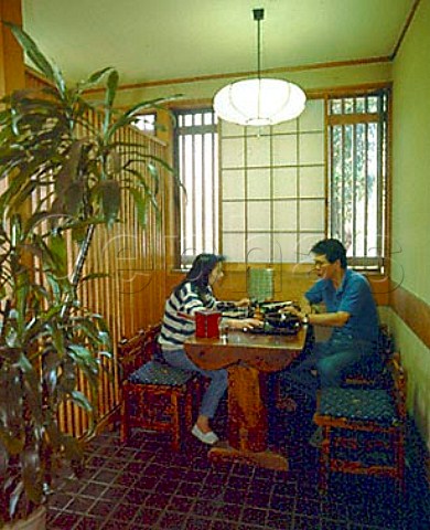 Couple eating soba Japanese noodles in a   specialist noodle restaurant  Tokyo Japan