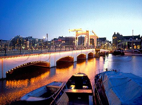 Magere Skinny Bridge crossing the river Amstel   in Amsterdam at dusk Netherlands