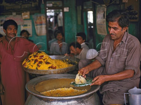 Cooking saffron rice in restaurant in Karachi   southern Pakistan