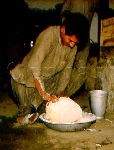 Baker kneading dough Gilgit Northern Pakistan