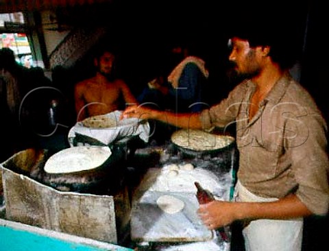 Baker Making chapaties Batura Valley   North Pakistan