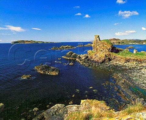 Dunyvaig Castle situated on a headland across the   bay from Lagavulin Distillery  Isle of Islay   Argyllshire Scotland