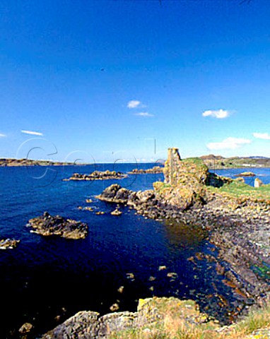 Dunyvaig Castle situated on a headland across the   bay from Lagavulin Distillery Isle of Islay   Argyllshire Scotland
