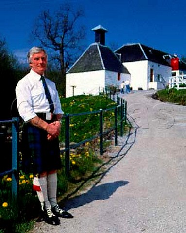 Edradour Distillery guide with the old Kiln and Malt   Barn Reception Centre beyond   Pitlochry Perthshire Scotland