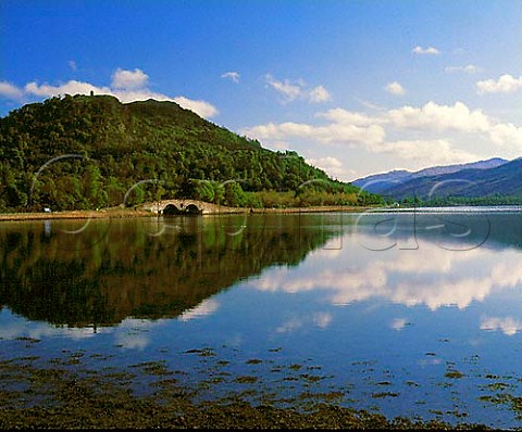 Bridge with Corrbhile hill reflecting in   Loch Fyne Inveraray Argyll Scotland