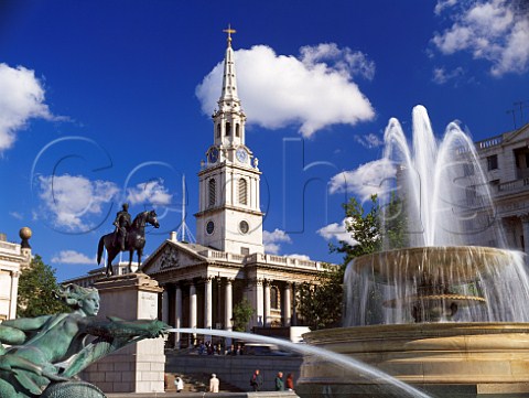 Fountains in Trafalgar Square with the church of   St MartinintheFields behind London