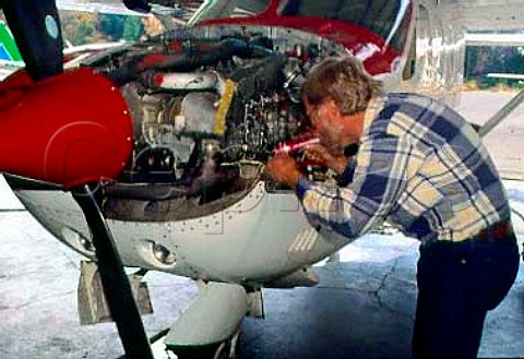 Dunn Vineyards Angwin Napa Co   California Randall Dunn working on his   Cessna plane